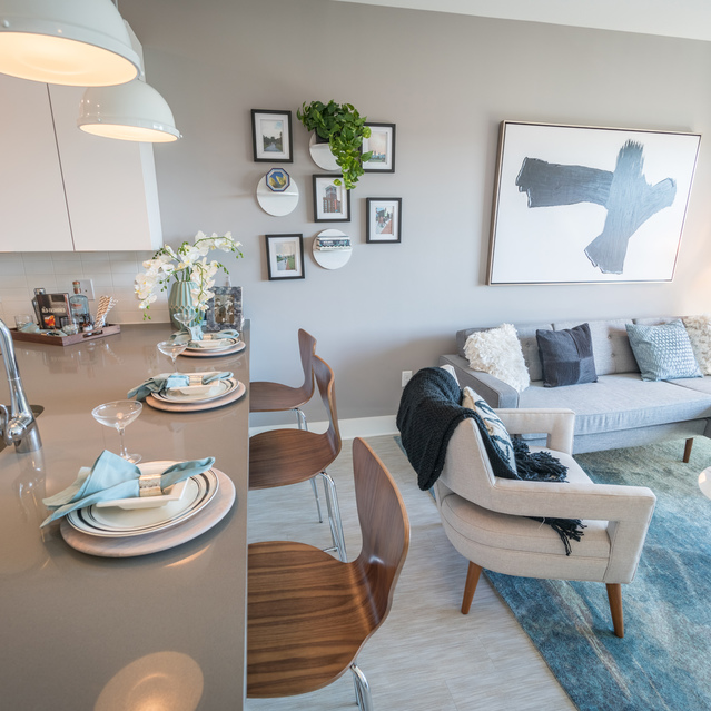 Anthem on Ashley - Carpeted Living Room with view of kitchen