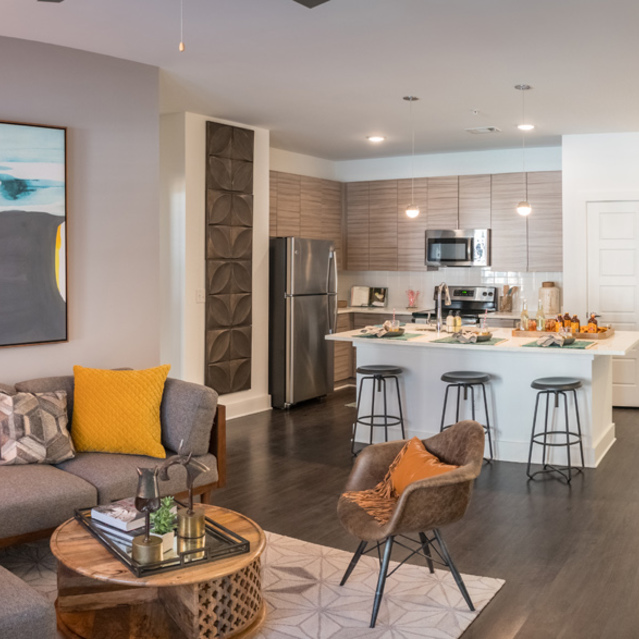 Anthem on Ashley - Carpeted Living Room