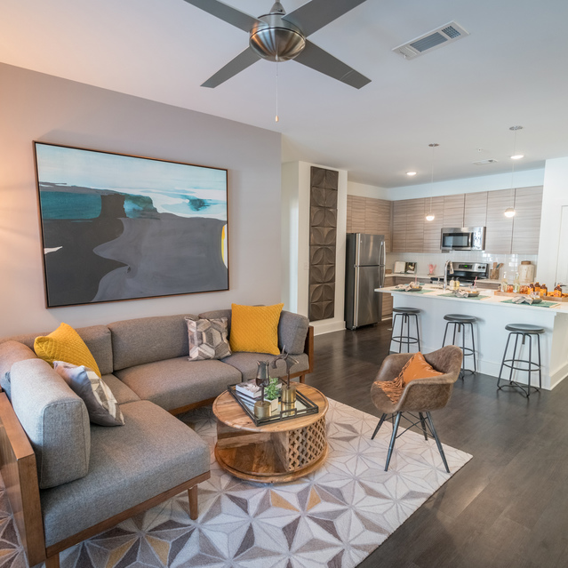 Anthem on Ashley - Carpeted Living Room